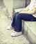 Girl sitting alone in the schoolyard