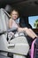 Girl Sitting In Booster Seat