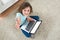 Girl Sitting On Carpet With Laptop