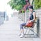 Girl sitting in chair outdoor