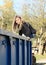 Girl sitting on a container