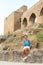 Girl sitting in front of unique bridge on Velhartice Castle