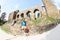 Girl sitting in front of unique bridge on Velhartice Castle