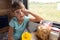 Girl sitting in a reserved seat carriage in a train funny looks in the frame