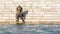 Girl sitting at the river bank