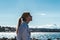 Girl Sitting on a Rock at Kitsilano Beach in Vancouver, Canada