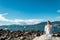 Girl Sitting on a Rock at Kitsilano Beach in Vancouver, Canada