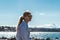 Girl Sitting on a Rock at Kitsilano Beach in Vancouver, Canada