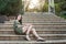 Girl sitting on stone steps