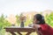 Girl sitting table with a jar of flower for children love nature concept