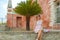 Girl sitting on a wall with colorful background