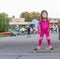 Girl skateboarding on natural background