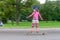 Girl skateboarding on natural background