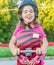 Girl skateboarding on natural background