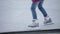 Girl skating with some minor difficulties on skate rink