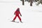 Girl skiing on a forest slope. White mountain landscape. Winter