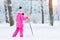 Girl is skiing in snow Park