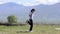 Girl skipping rope on a meadow