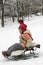 Girl sledding.