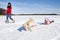 Girl sledding with dog