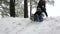 Girl sledding down the hill