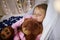 Girl sleeping with teddy bear