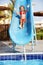 Girl sliding down water slide.