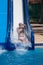 Girl sliding down water slides