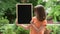 Girl with small blackboard