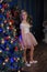 Girl in a smart pink dress in the Christmas