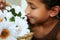 Girl Smelling Flowers