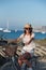 Girl smiles while riding a bicycle on the island of Formentera in the Balearic Islands in Spain