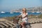 Girl smiles while riding a bicycle on the island of Formentera in the Balearic Islands in Spain