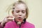 Girl smiling and blowing soap bubbles. Funny outdoors activity