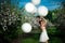 Girl smiling joyful holding bid air balloons