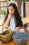 Girl snacking from a bowl of fresh blueberries