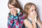 Girl sneeze with napkin paper on white background