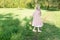 A girl sniffs a beautiful white apple tree, spring in the midst of the flowering of the apple tree is beautiful hair