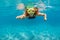 Girl in snorkeling mask dive underwater in blue sea lagoon