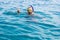 Girl snorkeling mask portrait looking at camera summer travel vacation life style time concept picture relaxation in Red sea