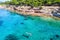 Girl snorkeling in the turquoise waters of Moni Island