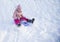 Girl on snow slides in winter time