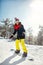 Girl snowboarder on mountain slope, ski resort