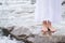 Girl soaking feet in stream