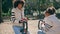 Girl spinning carousel mother at modern playground closeup. Family enjoy leisure