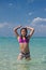 Girl splashing in the water at the beach