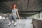 Girl in sport clothes and her sole shoe from under. sporty female exercise on bridge background. low angle shutting