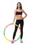 A girl in sport suit with hula hoop isolated on