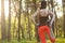 Girl sports. stretching. running in the forest