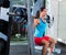 Girl squats in multipower squatting smith machine